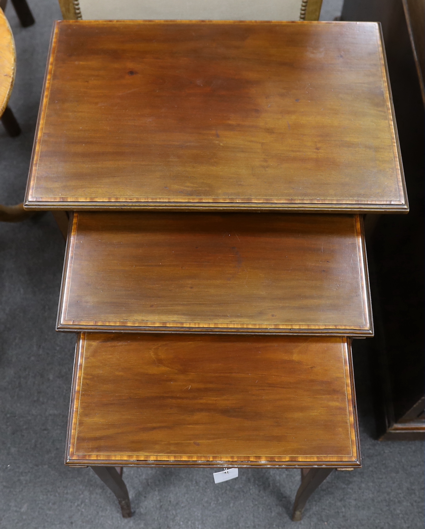 A quartetto of rectangular Edwardian satinwood banded mahogany tea tables, width 56cm, depth 37cm, height 70cm